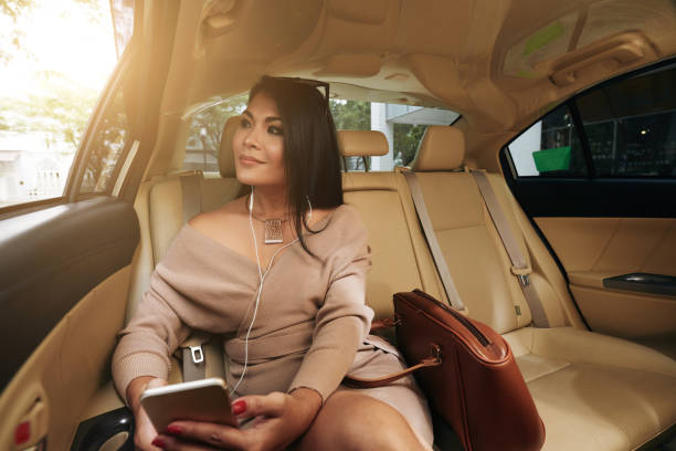 istock Beautiful woman in car 888661156