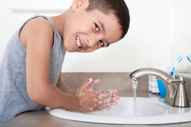 istock Cute asian boy washing hands 888666220