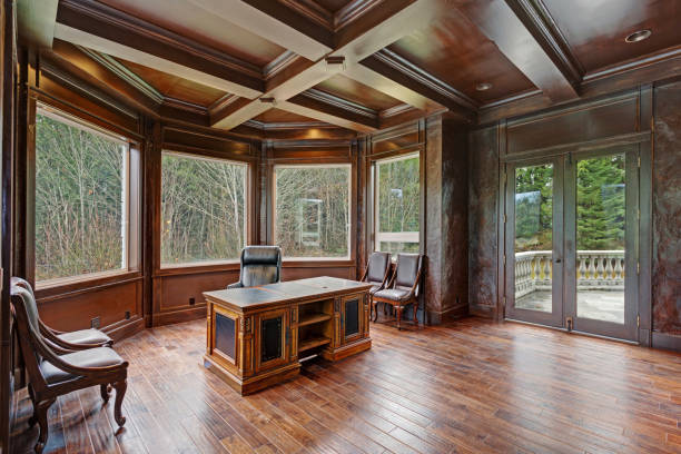 istock Chic Wood Paneled Home office features coffered ceiling 888672470