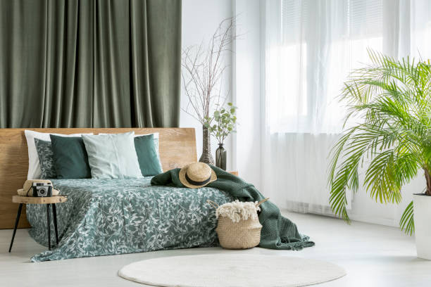 istock King-size bed in olive bedroom 888678010