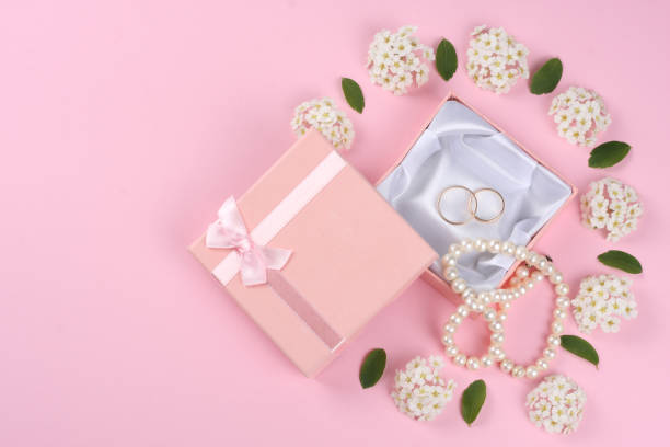 istock wedding rings on pink background. top view 888685034