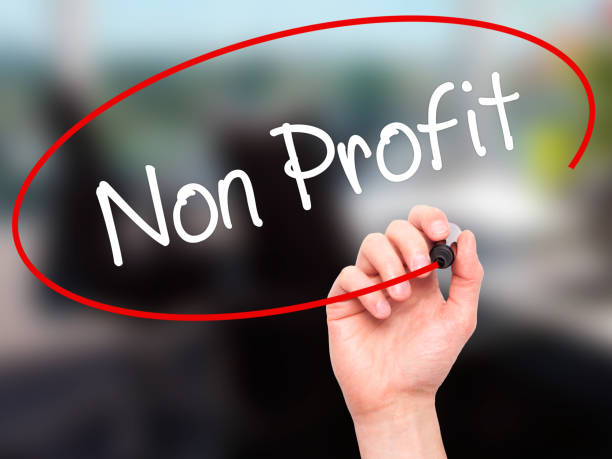 istock Man Hand writing Non Profit with black marker on visual screen 888685424