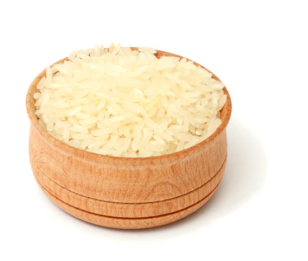 istock rice on wood bowl isolated on white background 888689118