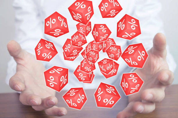 istock Man holding red cubes with a percent signs. 888692018