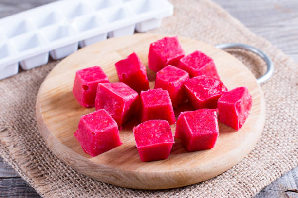 istock Frozen berry cubes on a cutting board 888698274