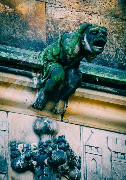 Photo of Czech architecture, scary gargoyle sculpture, gothic temple decoration.