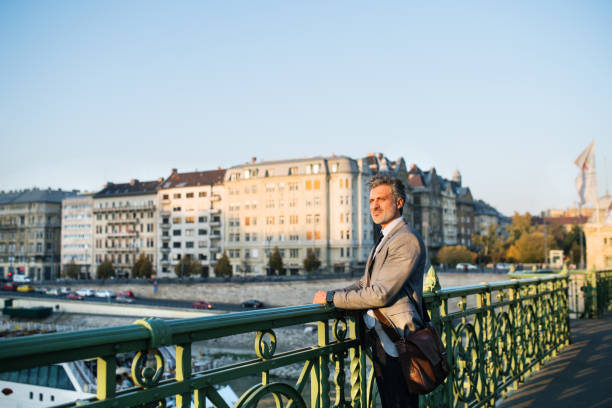 istock Mature businessman in a city. 888729074