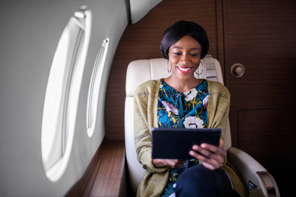 istock Woman in private jet airplane 888729612