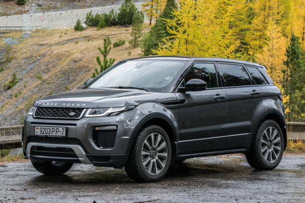 Range Rover Evoque Davos, Switzerland - October 3, 2017: Range Rover Evoque travels across Switzerland and European Alps to northern Italy. Photo taken in the Alps near Davos and on Umbrail pass. Range Rover Evoque is a compact SUV with a high functionality and great potential for long road travels. evoque stock pictures, royalty-free photos & images