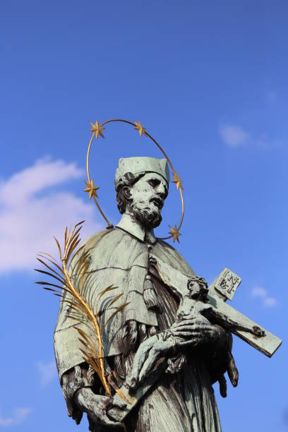 istock statue of John Nepomucene with crucifix 888735314