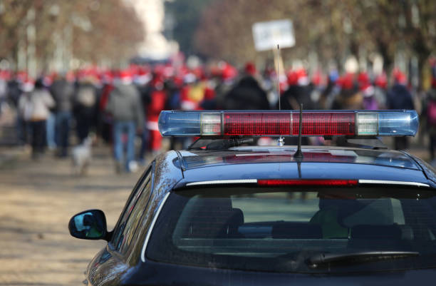 istock police car during the demonstration with the rioters 888735406