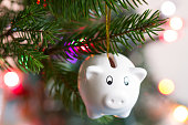 Save money and christmas concept with piggy bank and tree