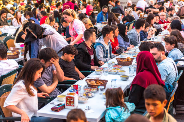 Muslim people gather to eat together for Ramadan kareem stock photo