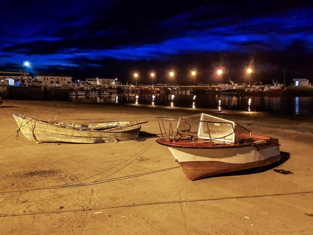 istock Vilaxoan fishing harbor at night 888755076