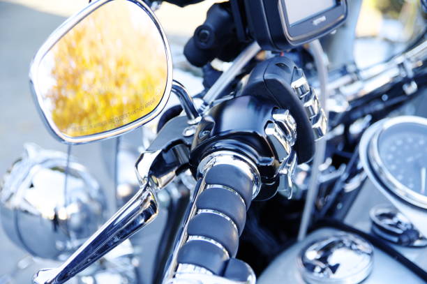 istock Motorcycle handlebars with yellow reflection in the rear-view mirror 888755742