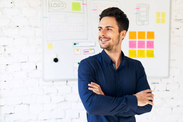 istock Portrait of happy web designer, programmer standing in office 888755910