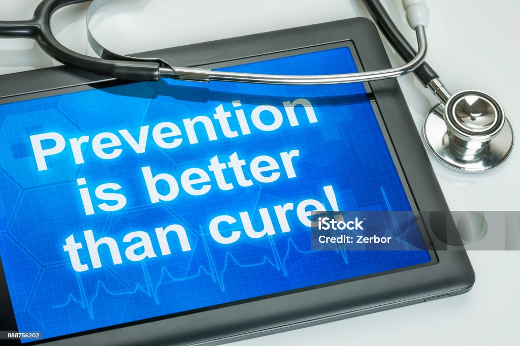 Tablet with the text Prevention is better than cure Analyzing Stock Photo