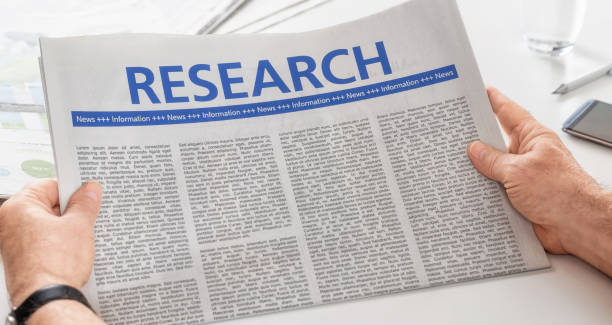 istock Man reading newspaper with the headline Research 888756484