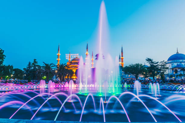 View of Sultanahmet Mosque with fountain in the foreground, Sultanahmet Park View of Sultanahmet Mosque with fountain in the foreground, Sultanahmet Park.ISTANBUL,TURKEY-JUNE 11,2017 azan stock pictures, royalty-free photos & images