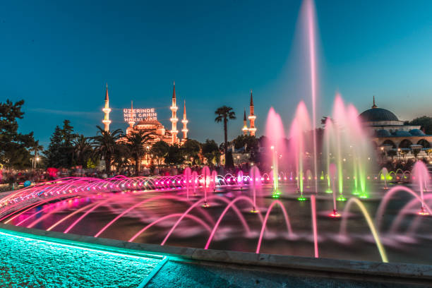 View of Sultanahmet Mosque with fountain in the foreground, Sultanahmet Park View of Sultanahmet Mosque with fountain in the foreground, Sultanahmet Park.ISTANBUL,TURKEY-JUNE 11,2017 azan stock pictures, royalty-free photos & images