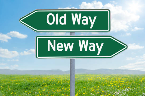 Two green direction signs - Old Way or New Way
