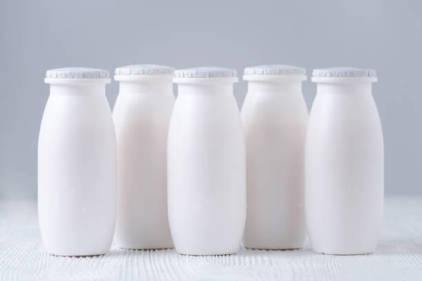 istock drink yogurt bottles on gray background 888759368