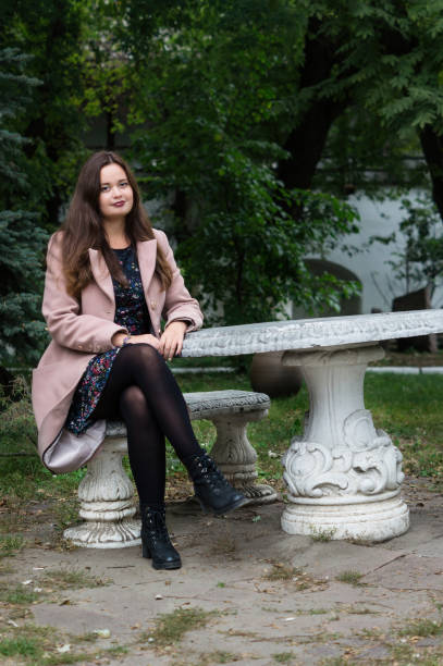 istock Girl sitting in the old park 888763280
