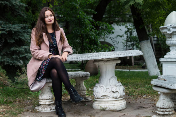 istock Girl sitting in the old park 888767202