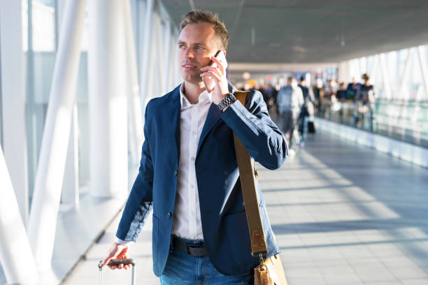 istock Man talking on phone in airport 888767690