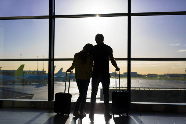 istock Couple waiting for flight in airport 888767790