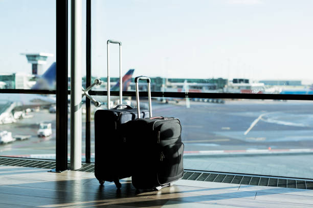 istock Two suitcases in airport 888768034