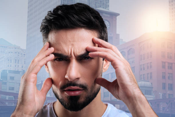 istock Serious attentive student frowning while concentrating at the examination 888772398