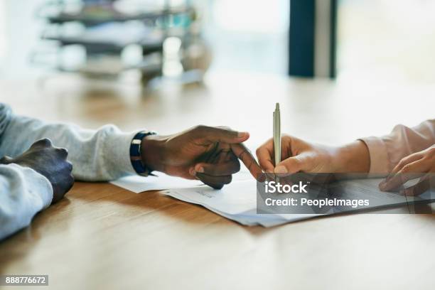 Running Over The Terms And Conditions In Her Contract Stock Photo - Download Image Now