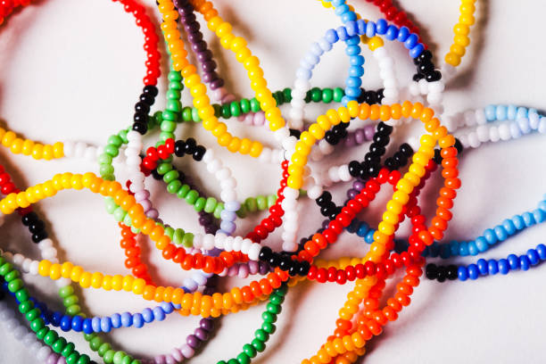 A macro image of a pile of colourful beads