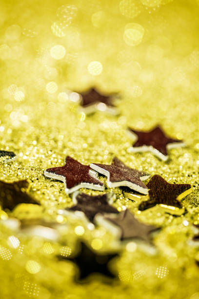 Stars with yellow glitter background Stars with yellow glitter background sterne stock pictures, royalty-free photos & images