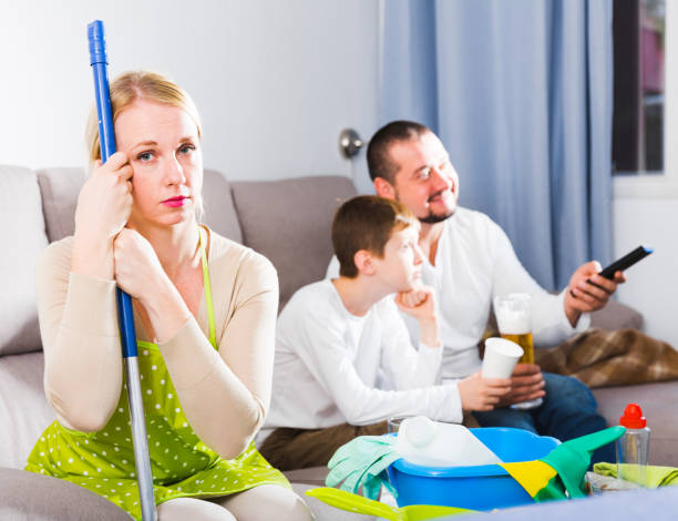 istock Upset woman with cleaning equipment 888797744