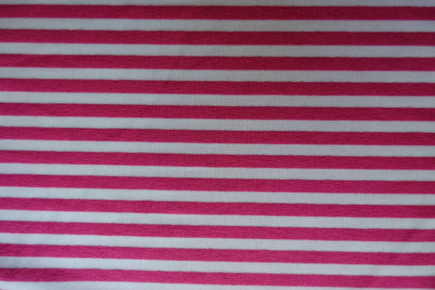 istock Horizontal pink stripes on fabric from above 888801328
