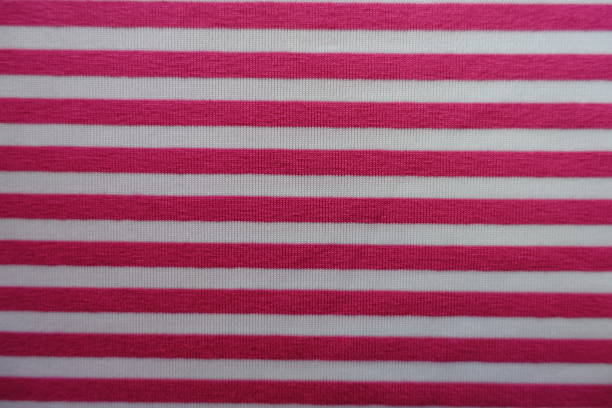 istock Cerise fabric with horizontal white stripes from above 888801602