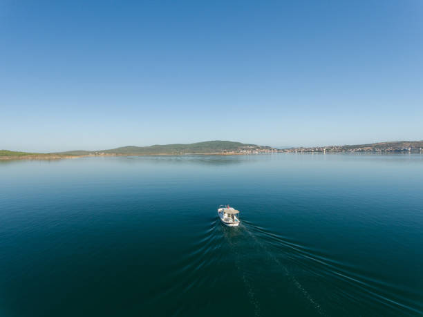 istock Fishing boat alone in the sea 888805598