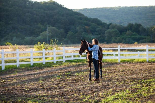 istock Beautiful girl with horse 888813098