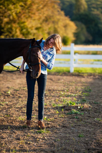 istock Beautiful girl with horse 888813450