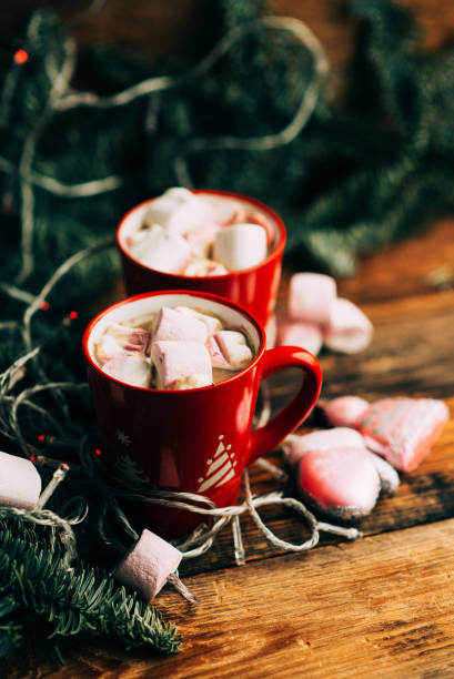 istock Christmas Hot Chocolate with Marshmallows in Red Mugs, square 888845982