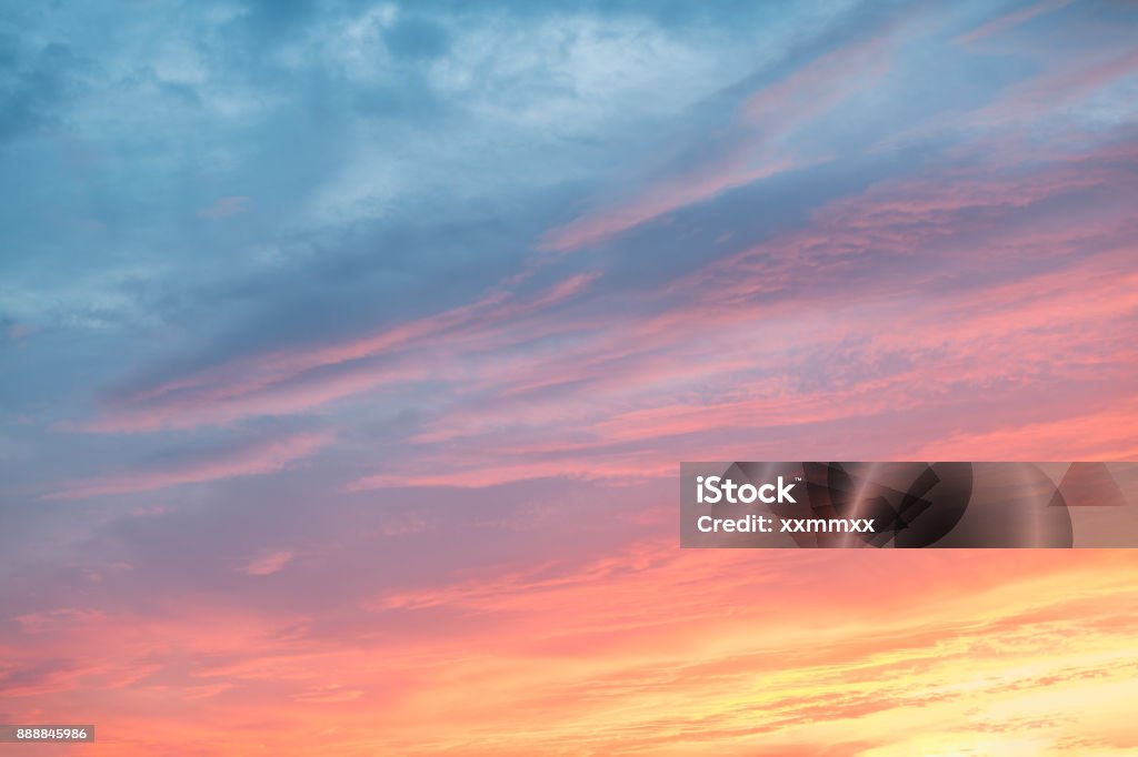 Colorful clouds on dramatic sunset sky Colorful clouds on dramatic sunset sky. This file is cleaned and retouched. Sky Stock Photo