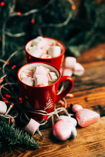 istock Christmas Hot Chocolate with Marshmallows in Red Mugs, square 888846072