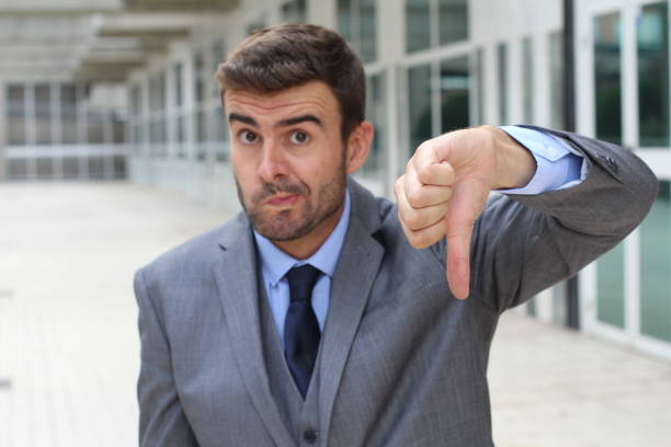 istock Apologetic businessman giving a thumbs down 888846434
