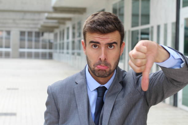 istock Apologetic businessman giving a thumbs down 888846506