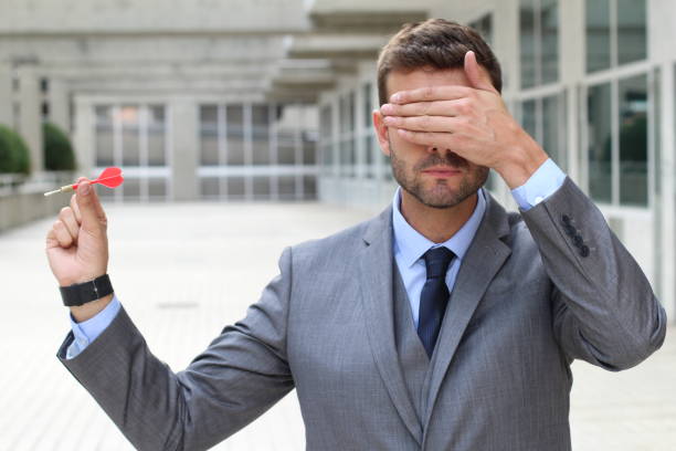 istock Impulsive businessman playing darts in office space 888846572