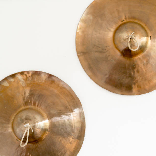 istock tow old Tibetan cymbals on a white wall 888847048