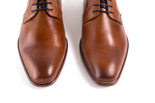 istock Male brown leather elegant shoe on white background 888851704