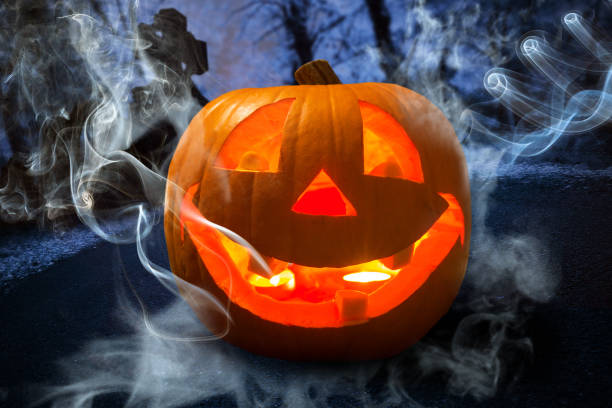 istock Halloween pumpkin glowing in the dark 888855564